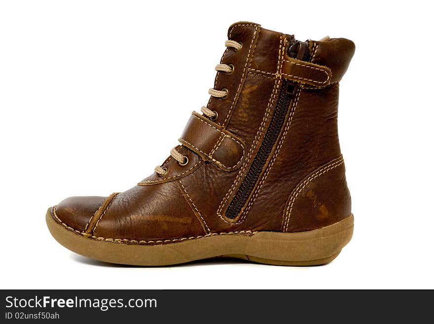 A brown high boot. The boot is taken on a white background.