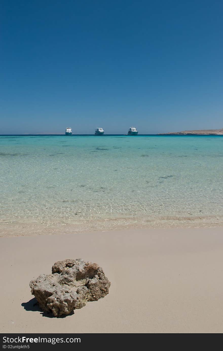 Tropical Lagoon Woth Boats On The Horizon