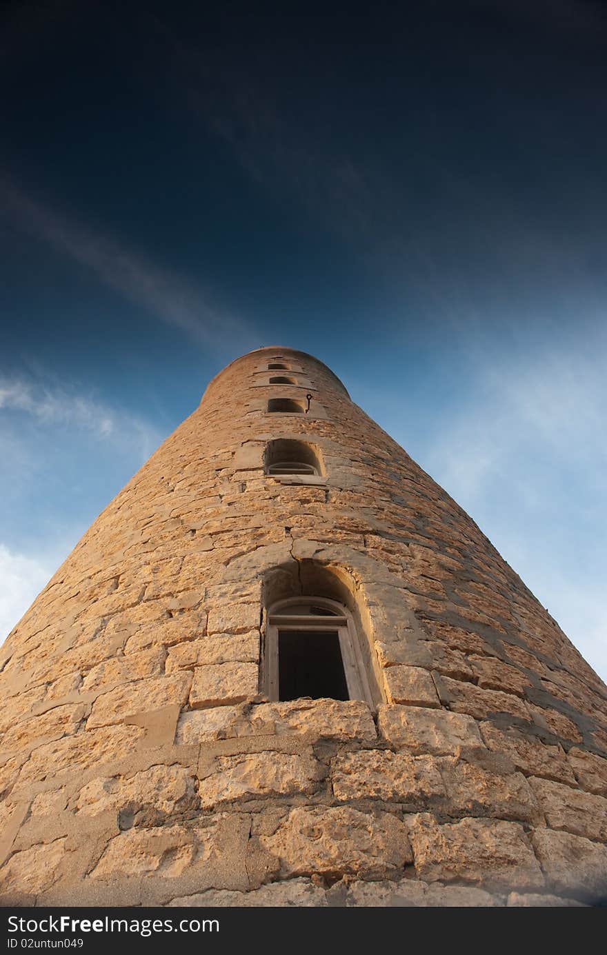 Low angle view of a stone lighthouse.