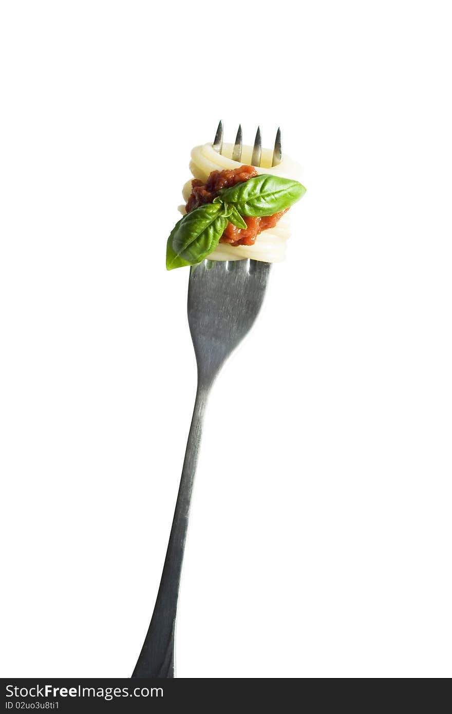 Pasta with basil on fork