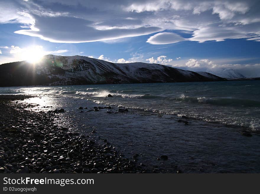 The spectacular view of Lake Tekapo, New Zealand, in winter with the snow mountain backdrop. The spectacular view of Lake Tekapo, New Zealand, in winter with the snow mountain backdrop.