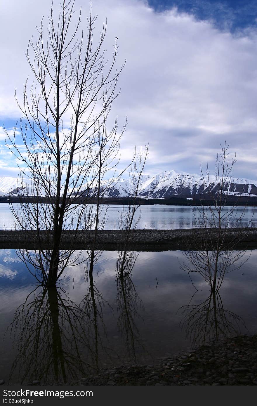 The spectacular view of Lake Tekapo, New Zealand, in winter with the snow mountain backdrop. The spectacular view of Lake Tekapo, New Zealand, in winter with the snow mountain backdrop.