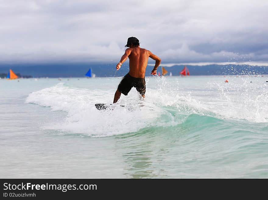 Portrait of skimboarder in action