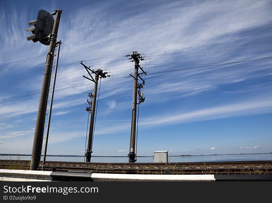 Electric poles along the railroad on natural background. Electric poles along the railroad on natural background.