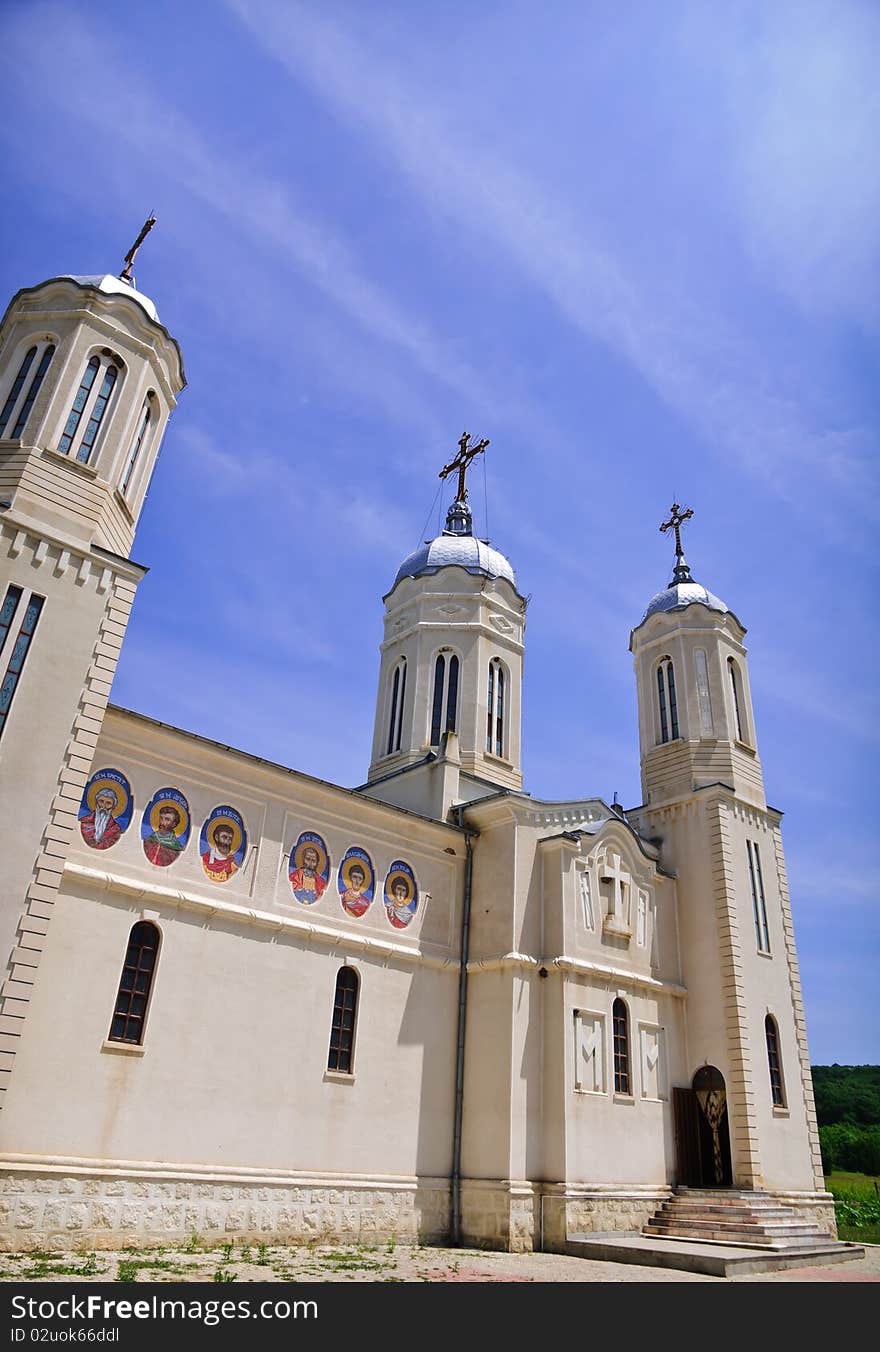 Church on a blue sky background located south of Danube river in Romania. The name of the church is St. Andrei.