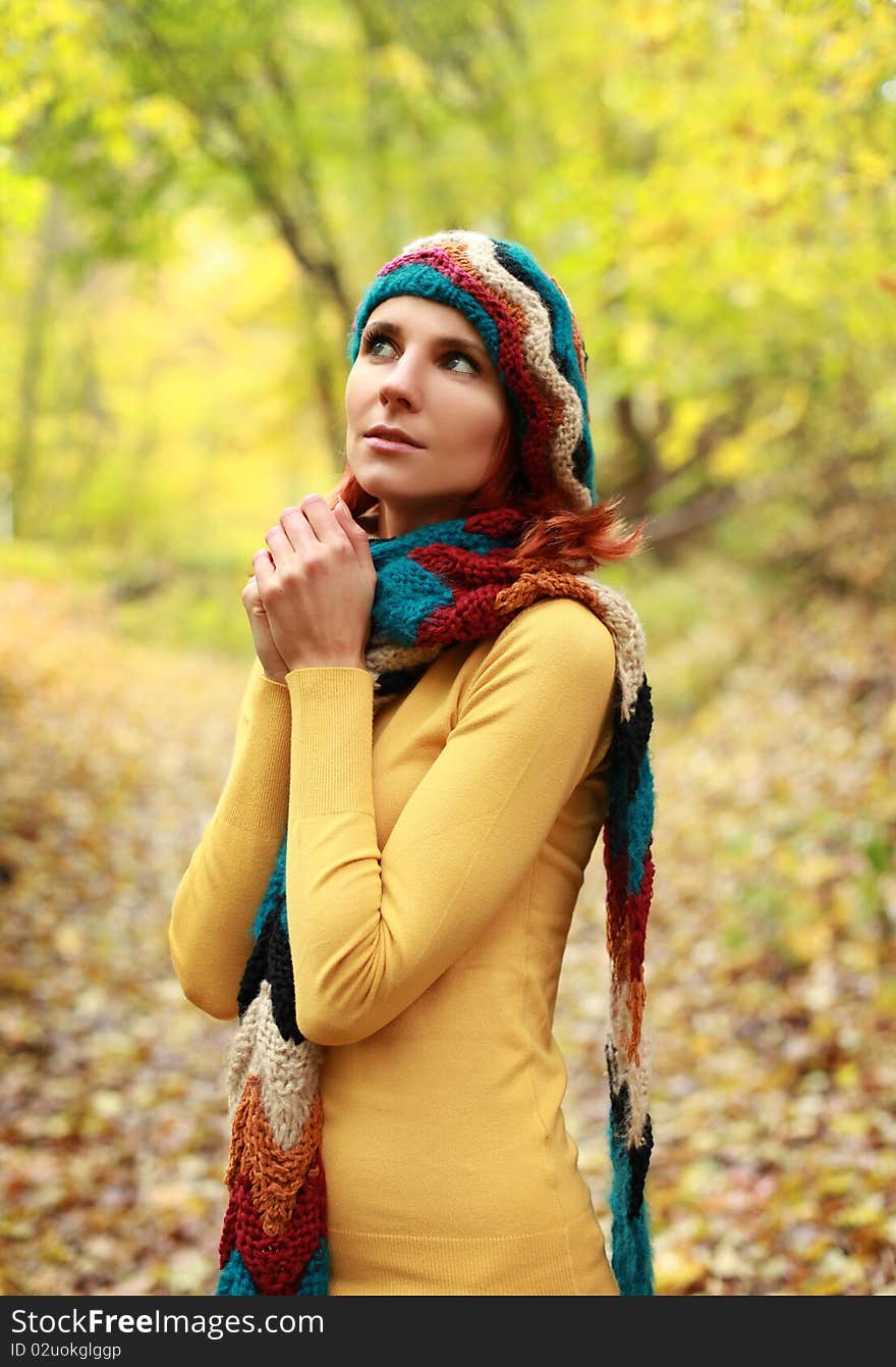 Young girl walking in autumn park. Young girl walking in autumn park