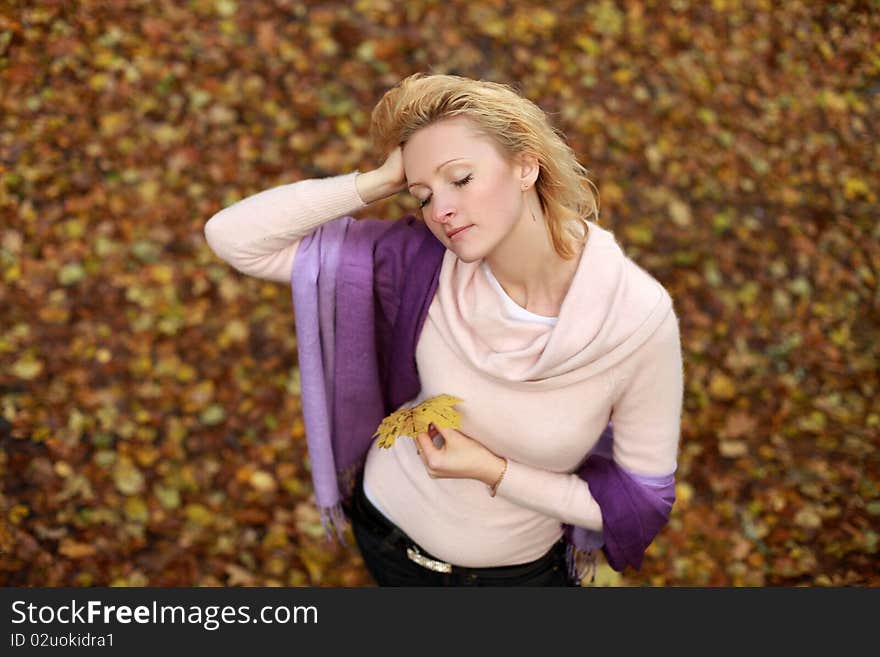 Beautiful blond woman in autumn park. Beautiful blond woman in autumn park