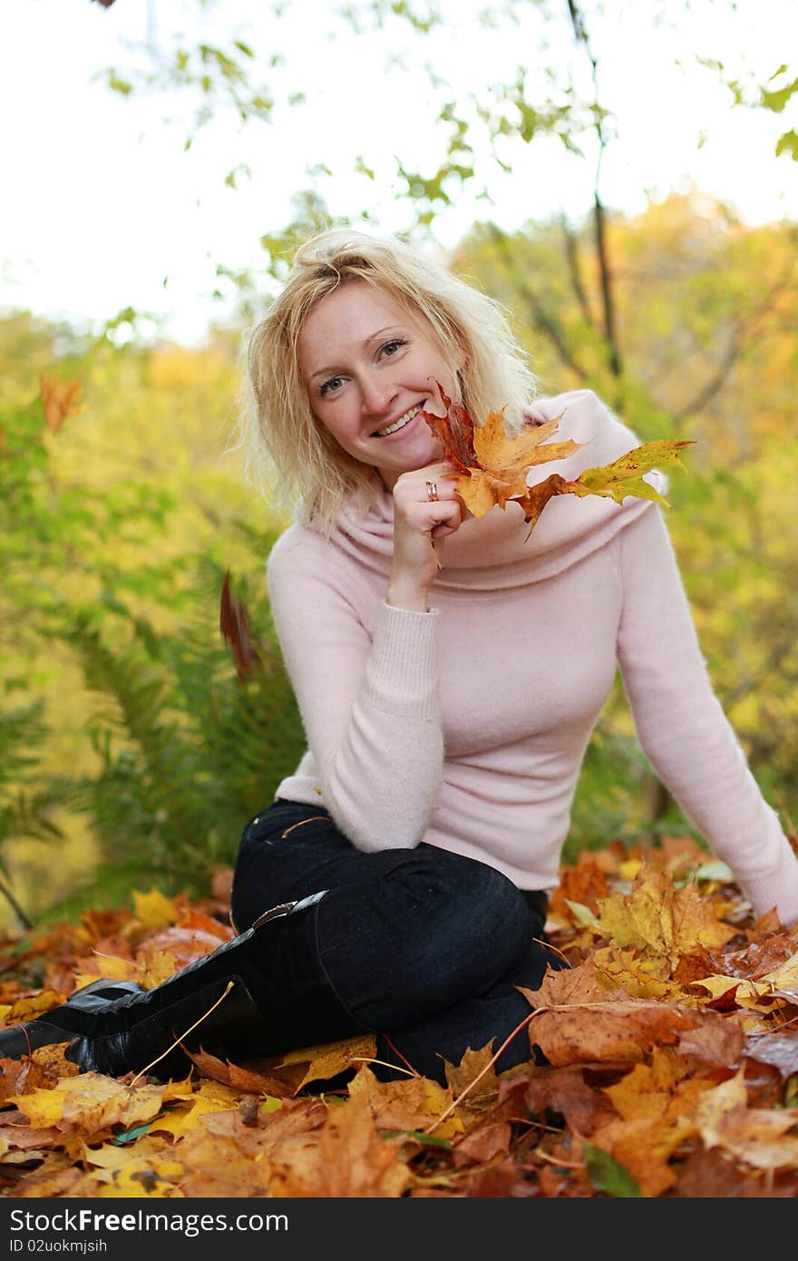 Beautiful blond woman in autumn park. Beautiful blond woman in autumn park