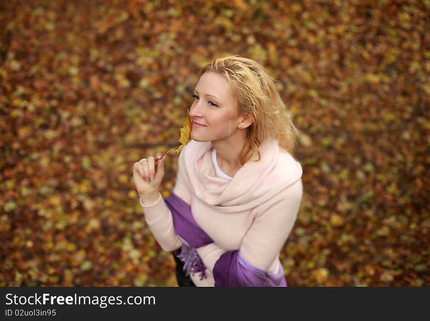 Beautiful blond woman in autumn park. Beautiful blond woman in autumn park