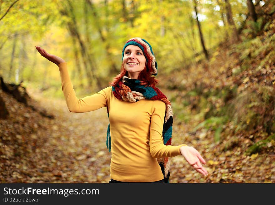 Young girl walking in autumn park. Young girl walking in autumn park