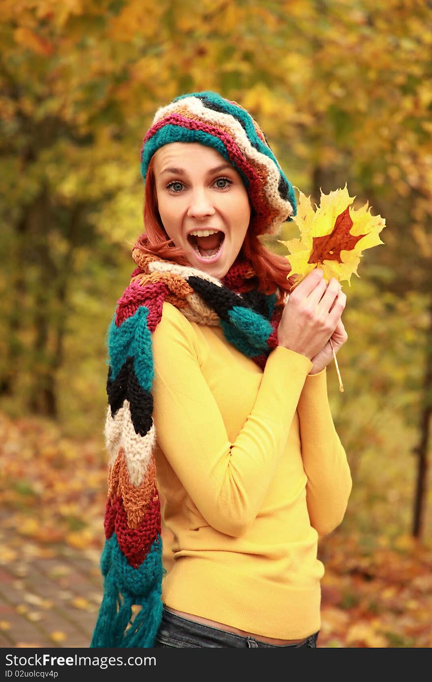 Young girl walking in autumn park. Young girl walking in autumn park