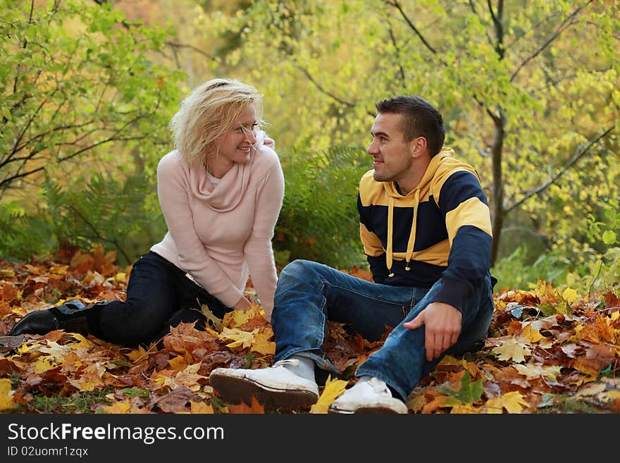 Beautiful couple having fun in autumn park. Beautiful couple having fun in autumn park