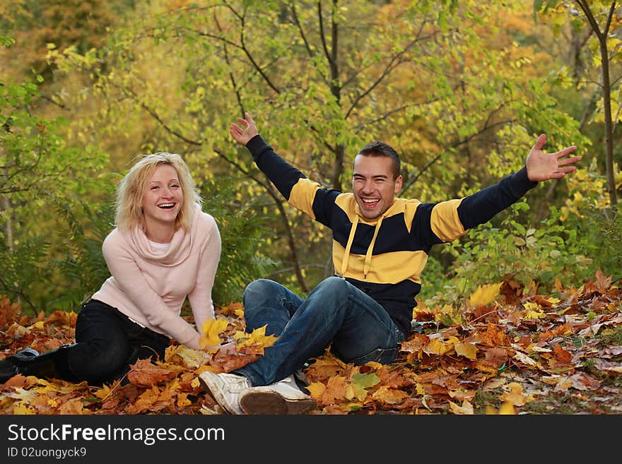 Beautiful couple having fun in autumn park. Beautiful couple having fun in autumn park