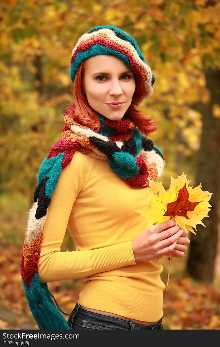 Young girl walking in autumn park. Young girl walking in autumn park