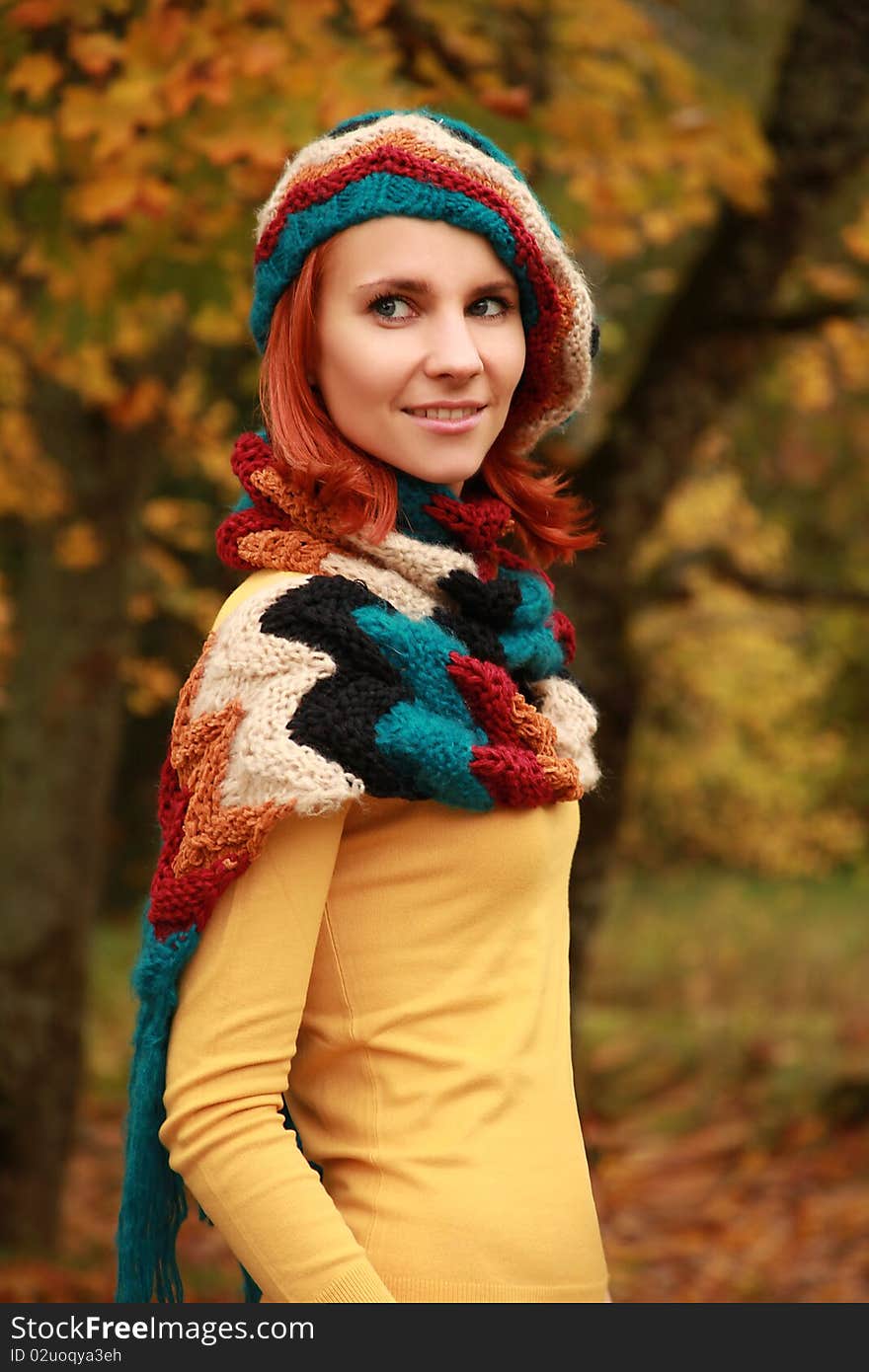 Young girl walking in autumn park. Young girl walking in autumn park