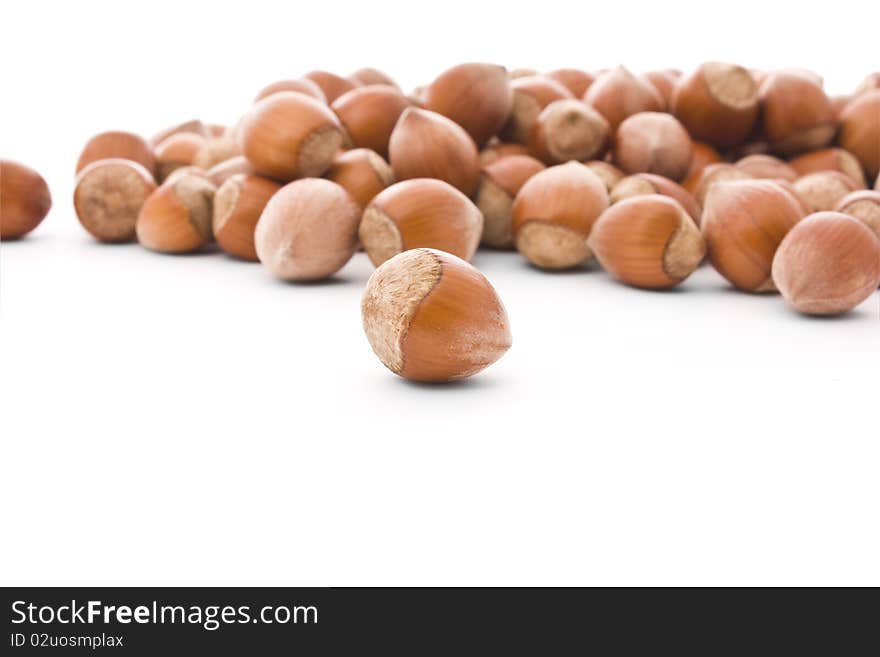 Brown haselnuts isolated on white