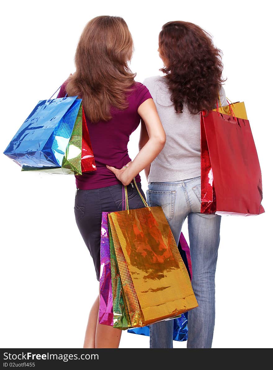 Two friends from the back with shopping on a white background