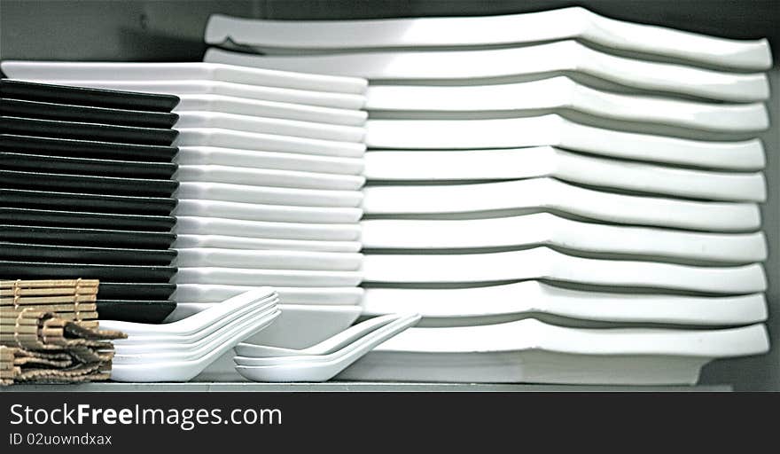 Stack of white and black square plates