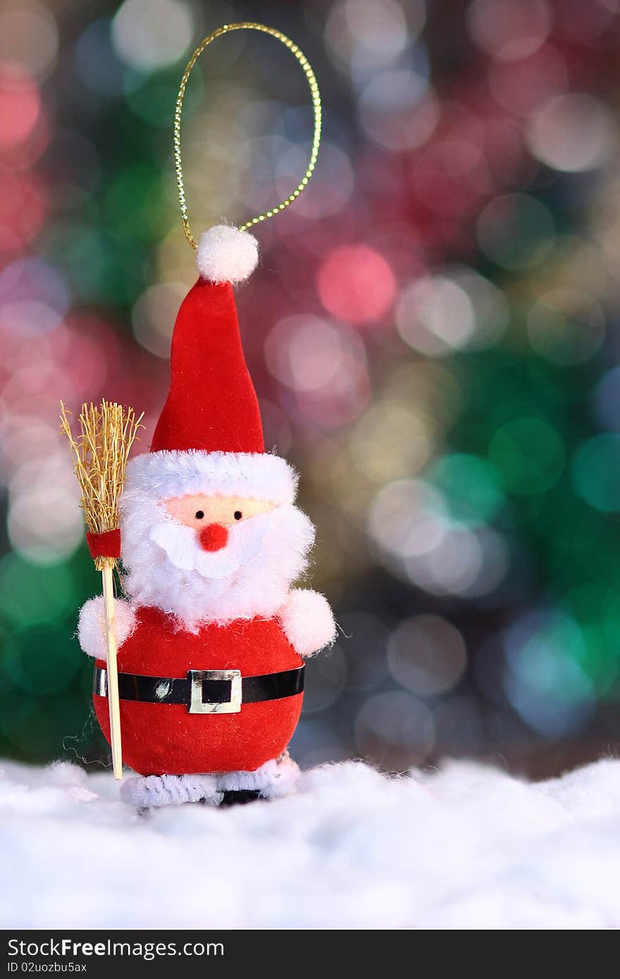 Decorative doll of a Santa Claus on festive background