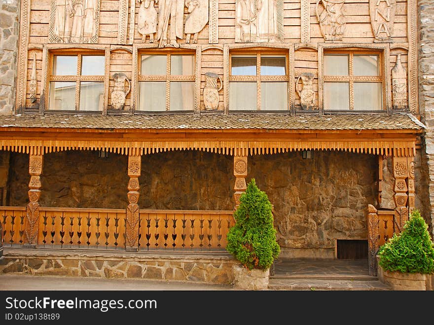 Wooden carved wall of pub exterior. Wooden carved wall of pub exterior