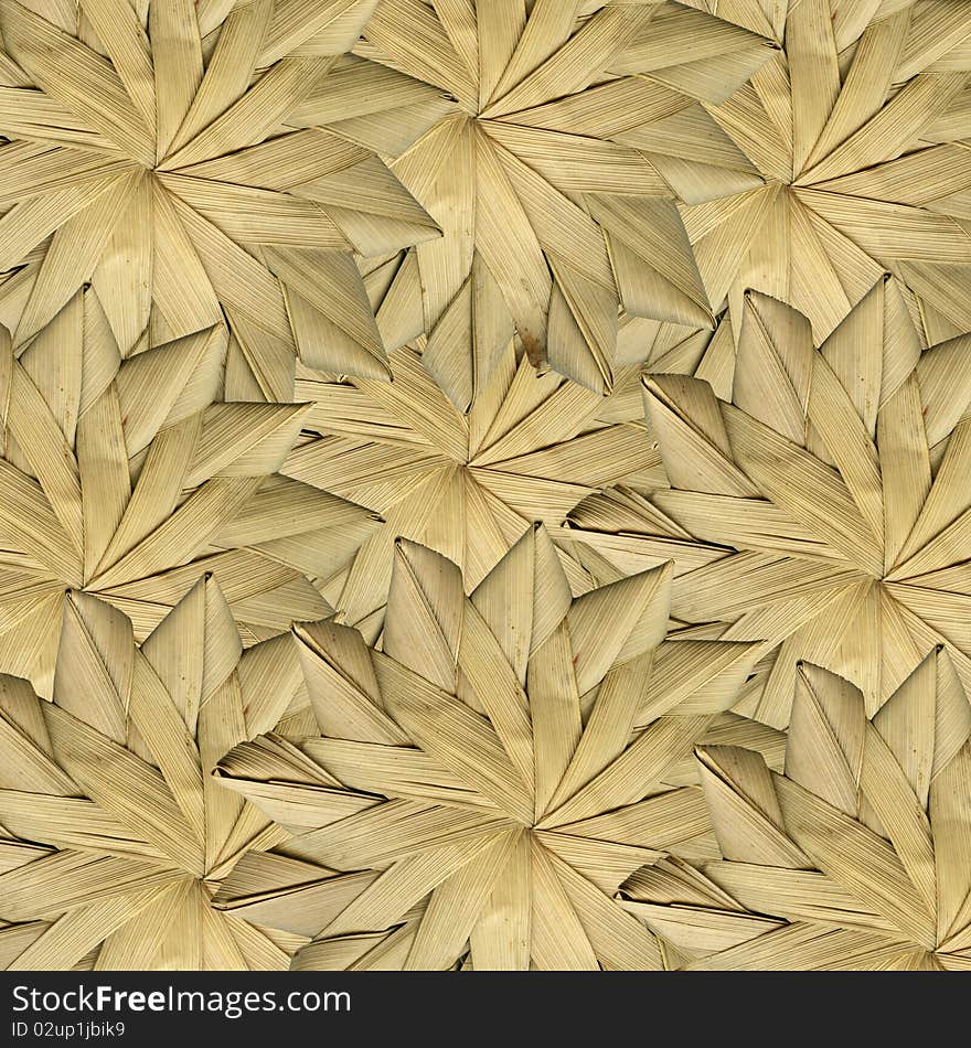 Dried leaves woven together in design. Dried leaves woven together in design