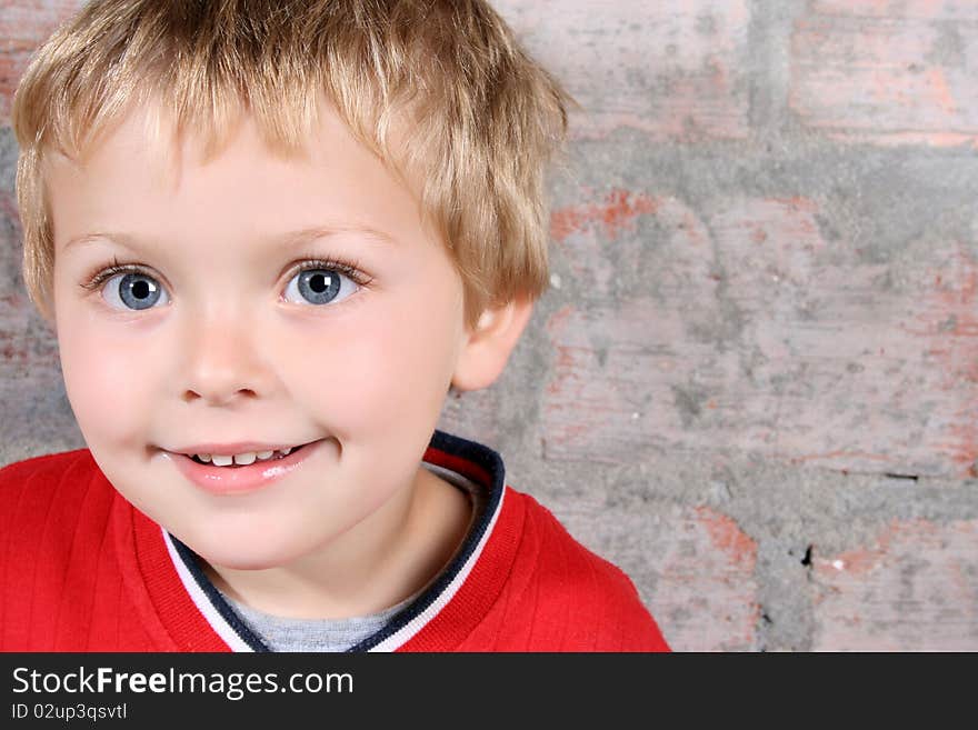 Cute blond boy with big blue eyes