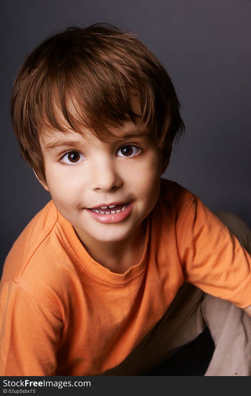 Portrait of happy smiling beautiful boy, studio shot. Portrait of happy smiling beautiful boy, studio shot