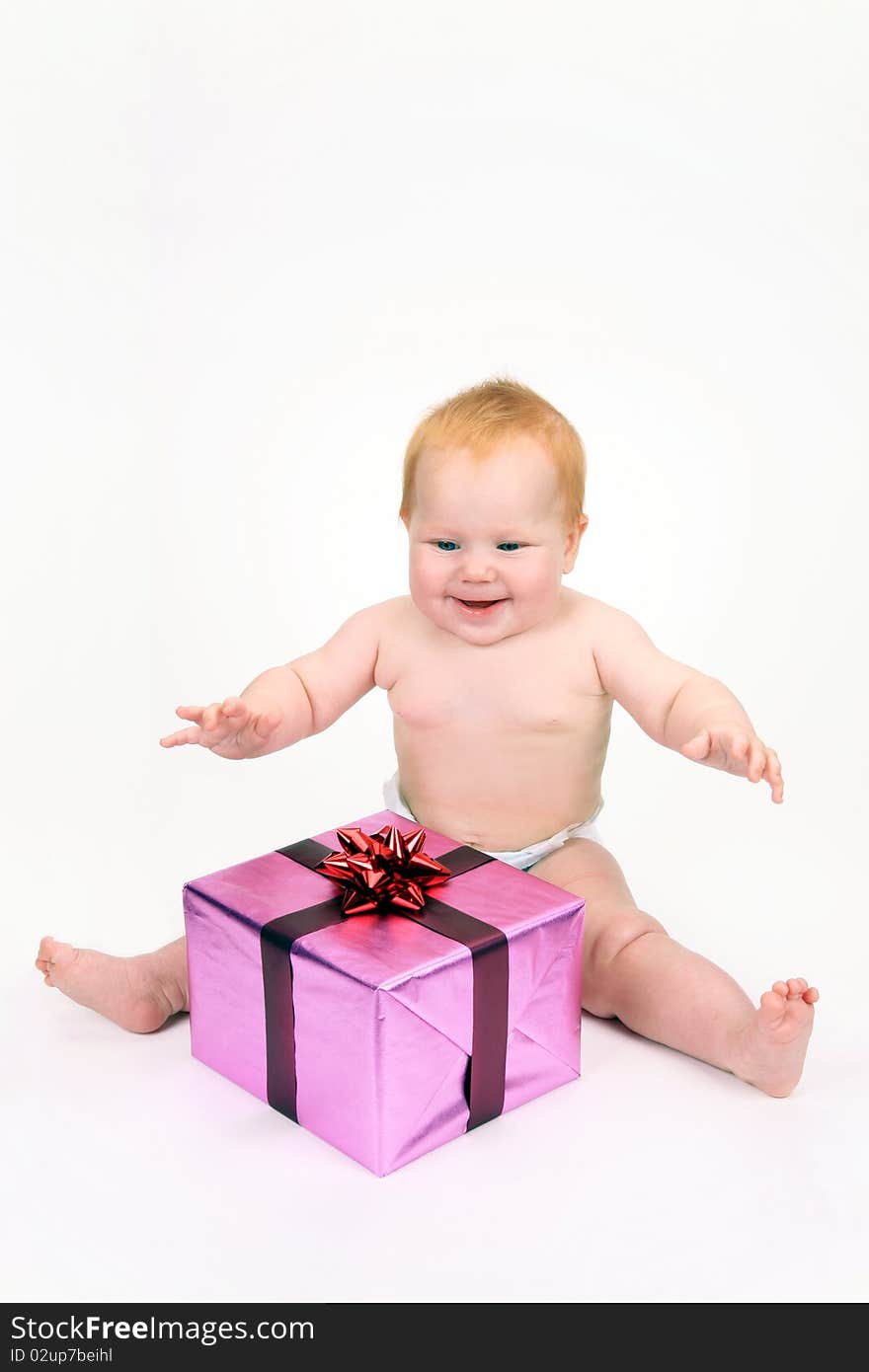 The child rejoicing to a gift on a white background