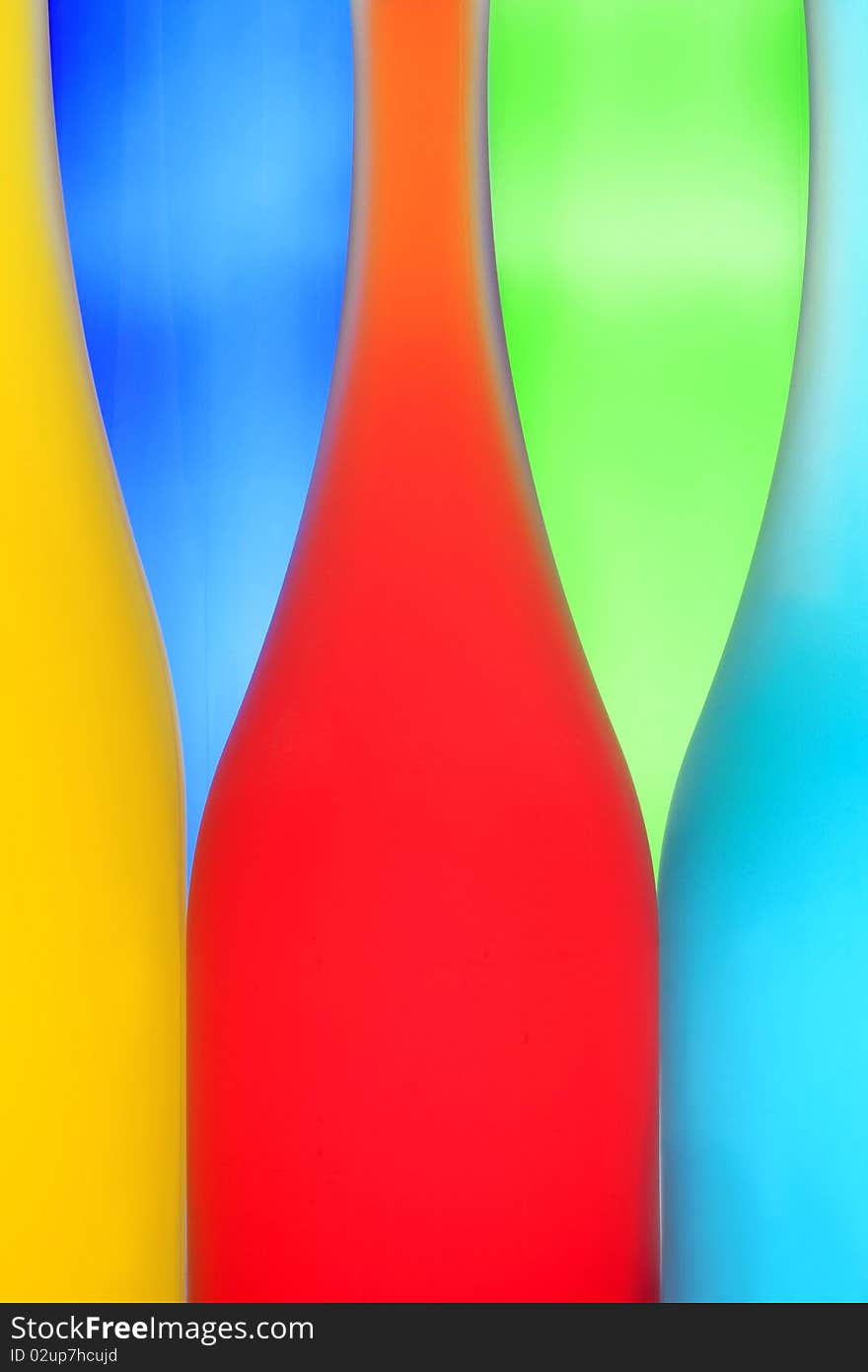 Three color bottles on a multi-colored background