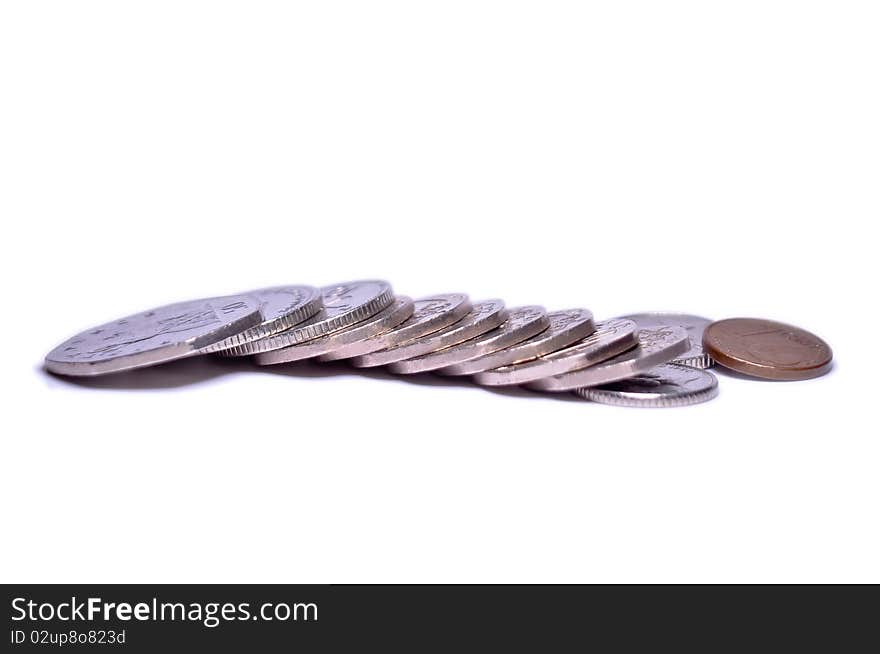 Several british coins and one euro isolated on white background. Several british coins and one euro isolated on white background