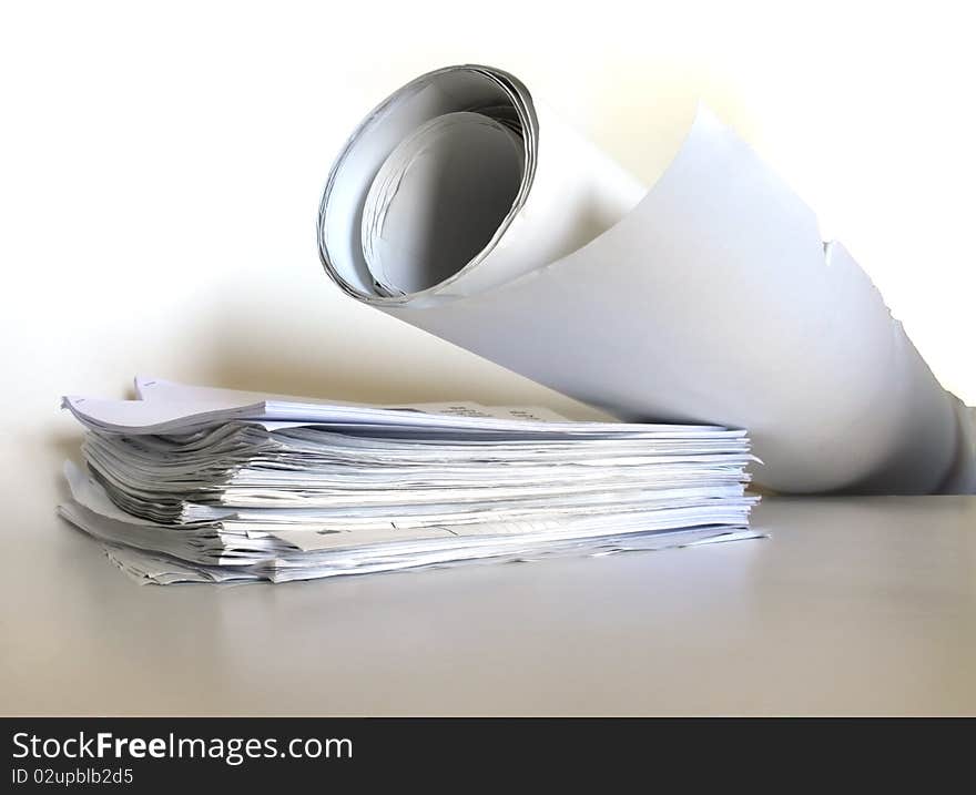 A stacked and rolled papers isolated on white background