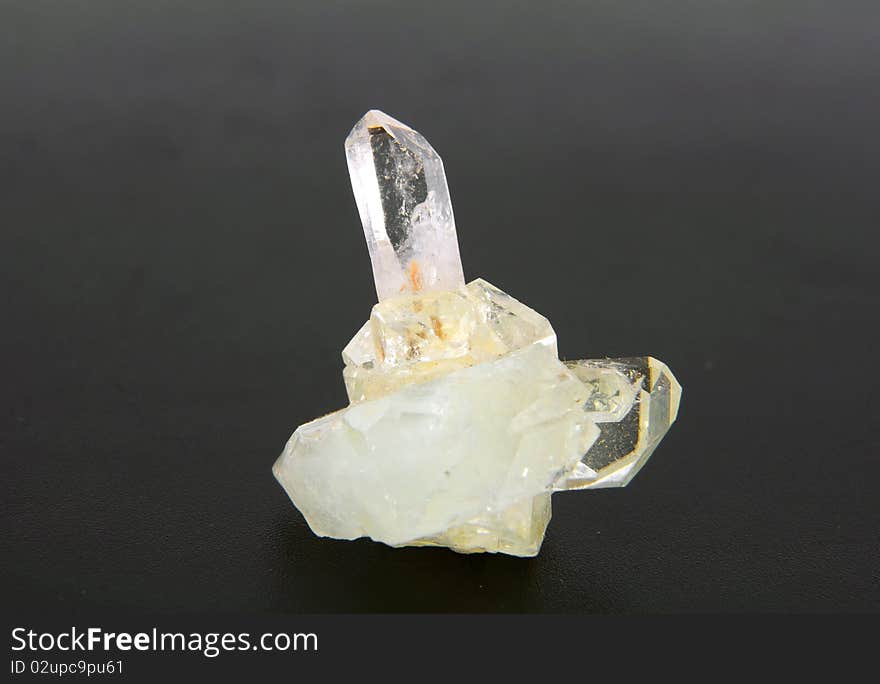 Large quartz crystal on a gray background