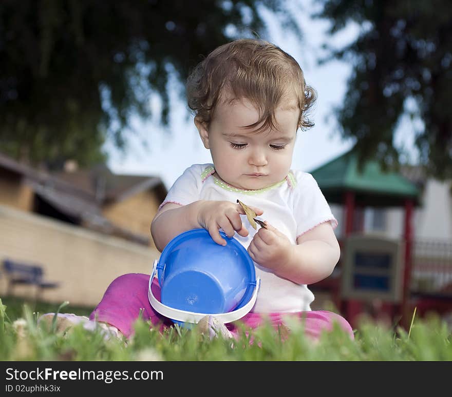 Cute baby is playing at the playground. Cute baby is playing at the playground