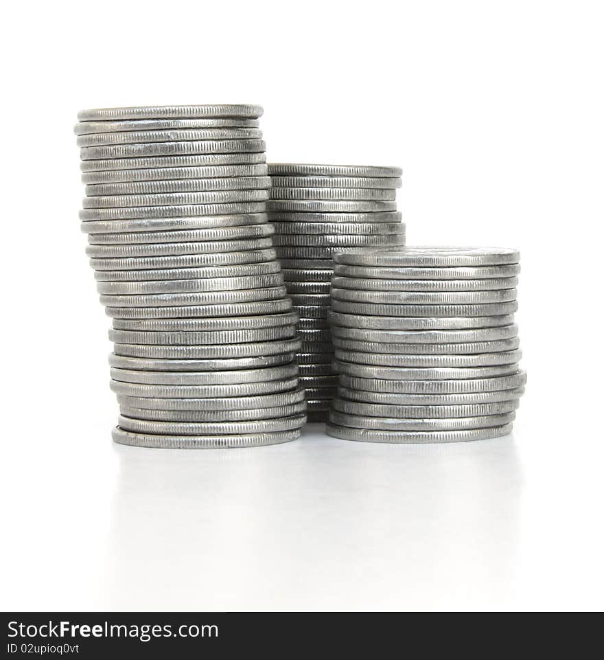 Three columns of Silver Coins isolated on white background. Three columns of Silver Coins isolated on white background