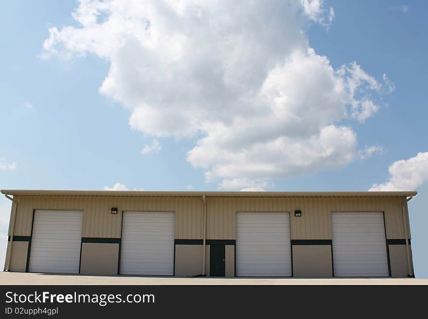 Four closed doors wait for business for this loading bay.