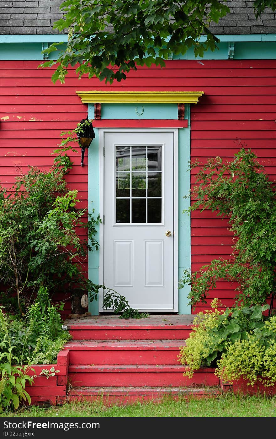 Door surrounded by foliage with vibrant colors. Door surrounded by foliage with vibrant colors