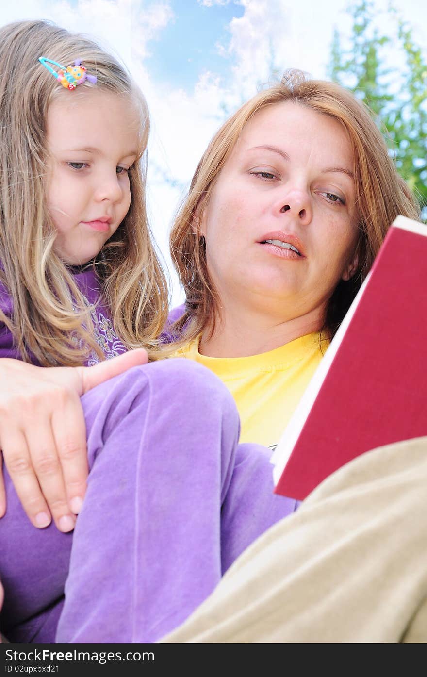 Mother and daughter reading a book