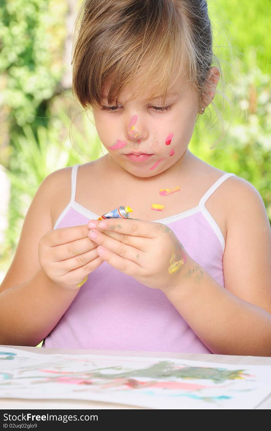 A Child Playing With Colors