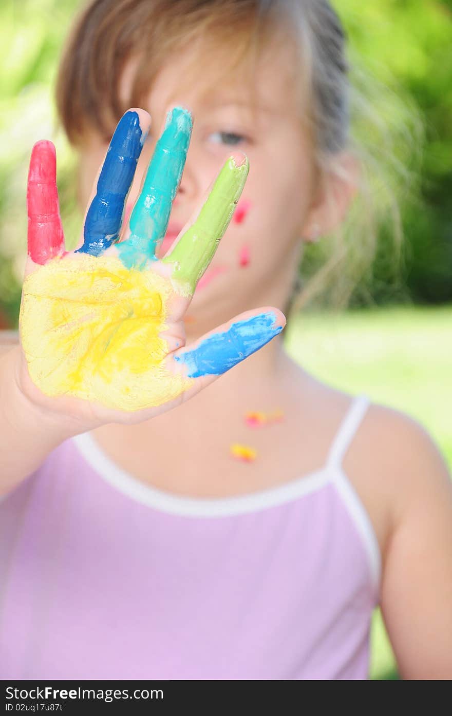 Girls colored face and hands in various colors. Girls colored face and hands in various colors