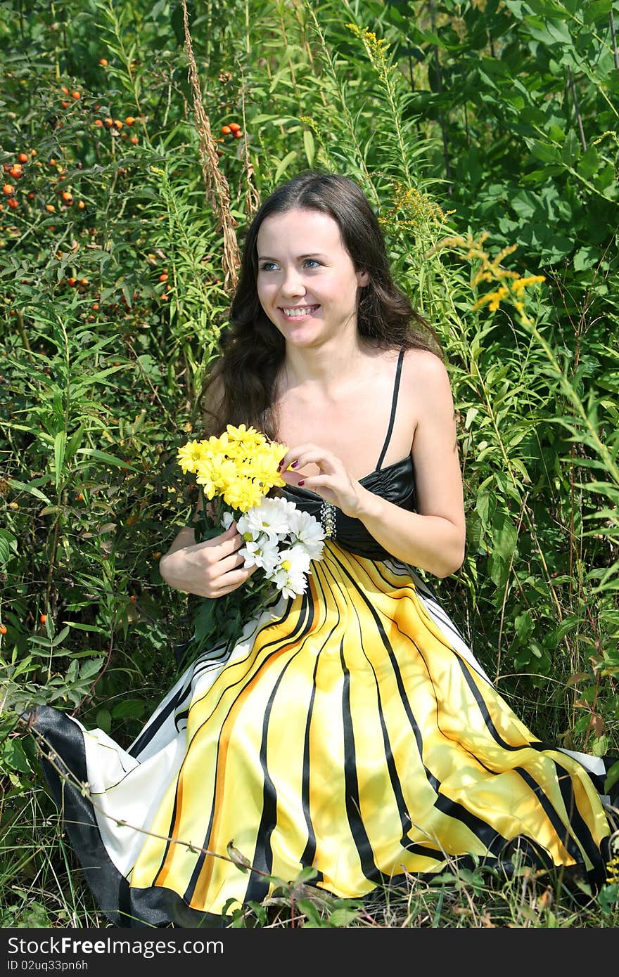 Girl with a bunch of flowers. Girl with a bunch of flowers