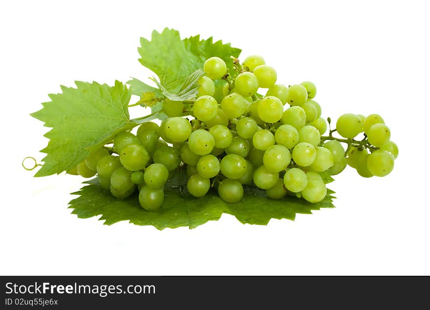 Bunch of fresh grapes and leaves isolated on white