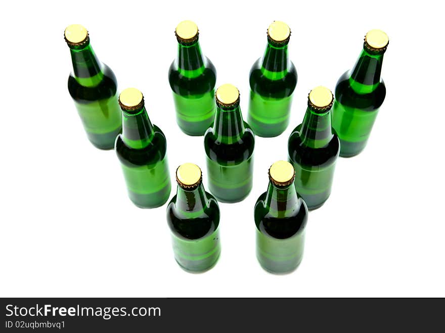 Rows from beer bottles on white background. Rows from beer bottles on white background.