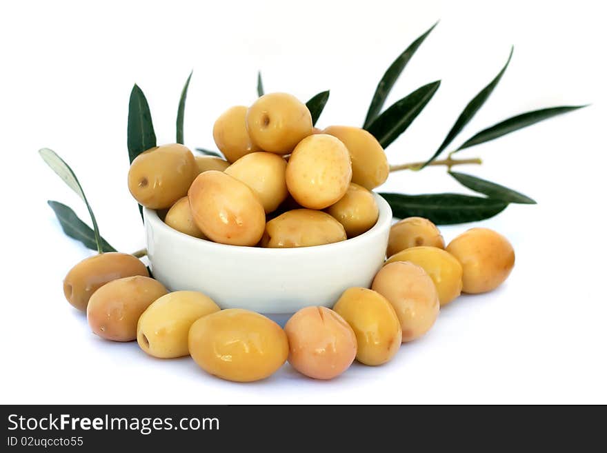 Green olives with leaves isolated on white background