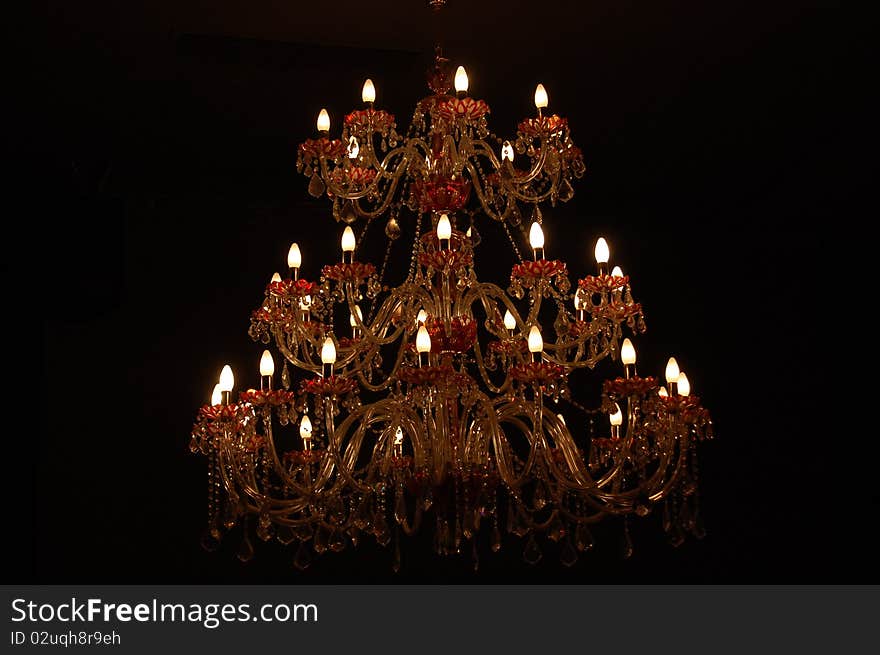 Beautiful chandelier with candles shining. Beautiful chandelier with candles shining