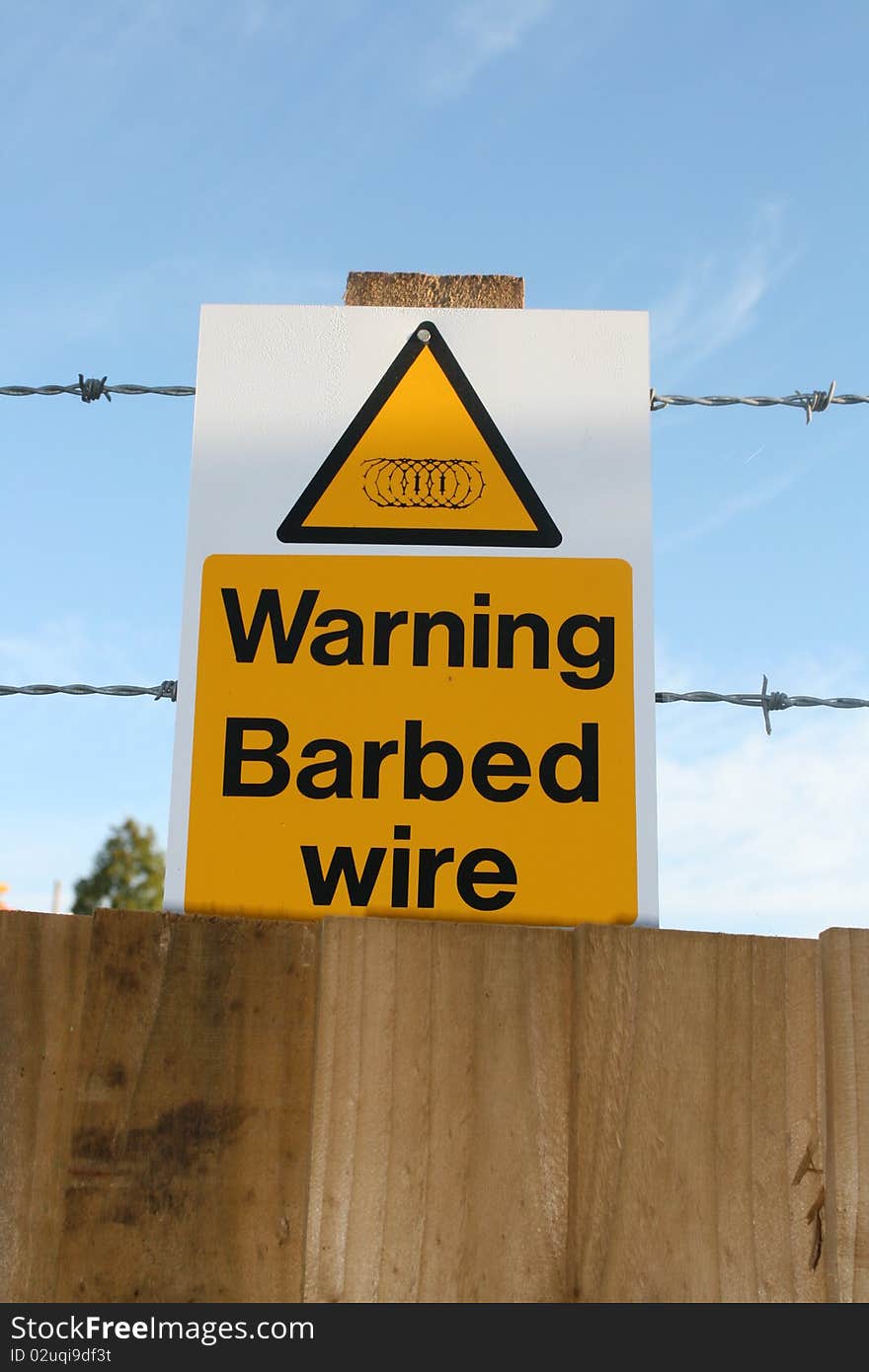 Image of a barbed wire warning sign at a construction site