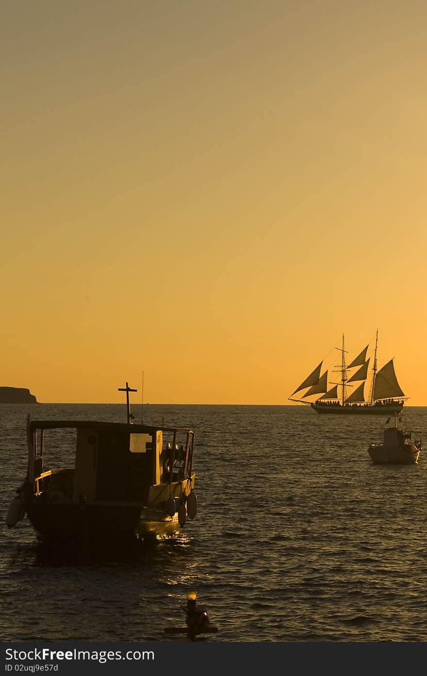 Sunset over port of Mykonos, Greece