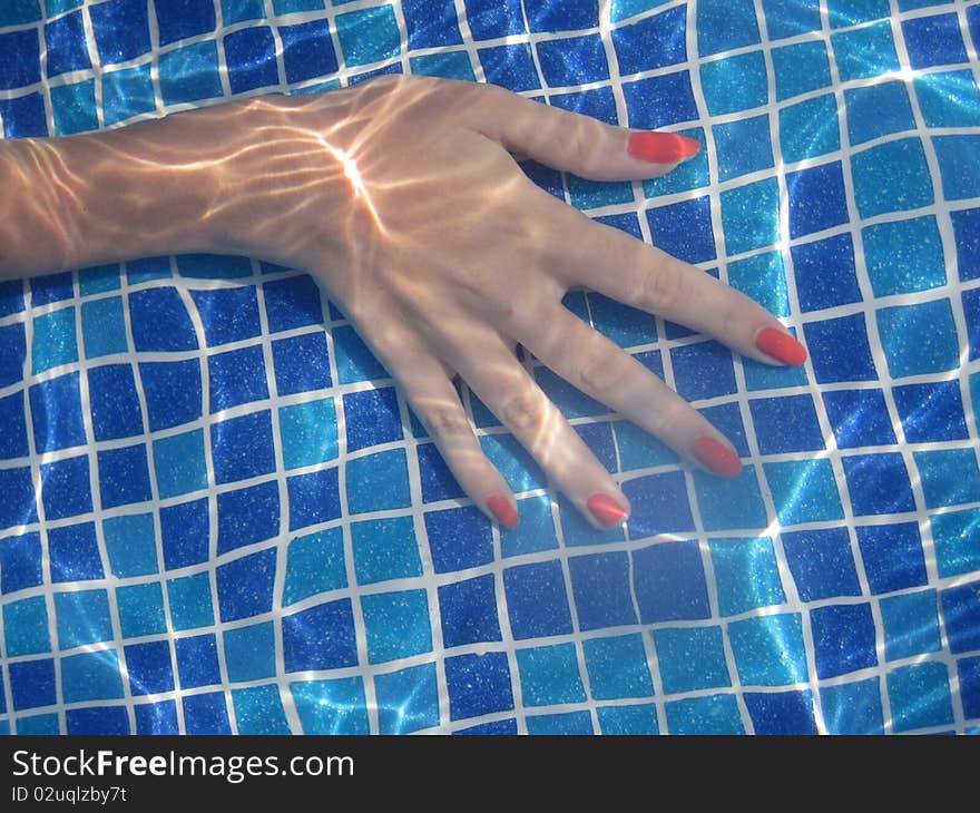 Hand in pool under water. Hand in pool under water