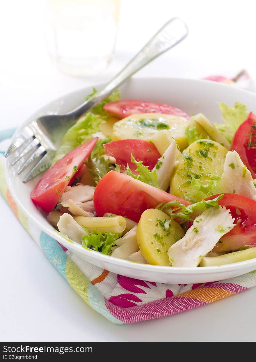 Salad from potatoes, lettuce, tomatoes and beans