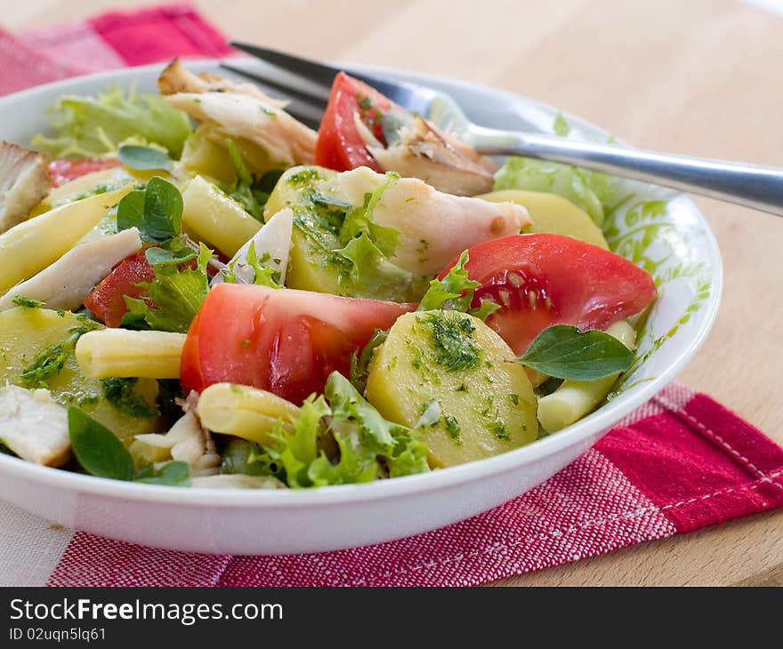 Salad from potatoes, lettuce, tomatoes and beans