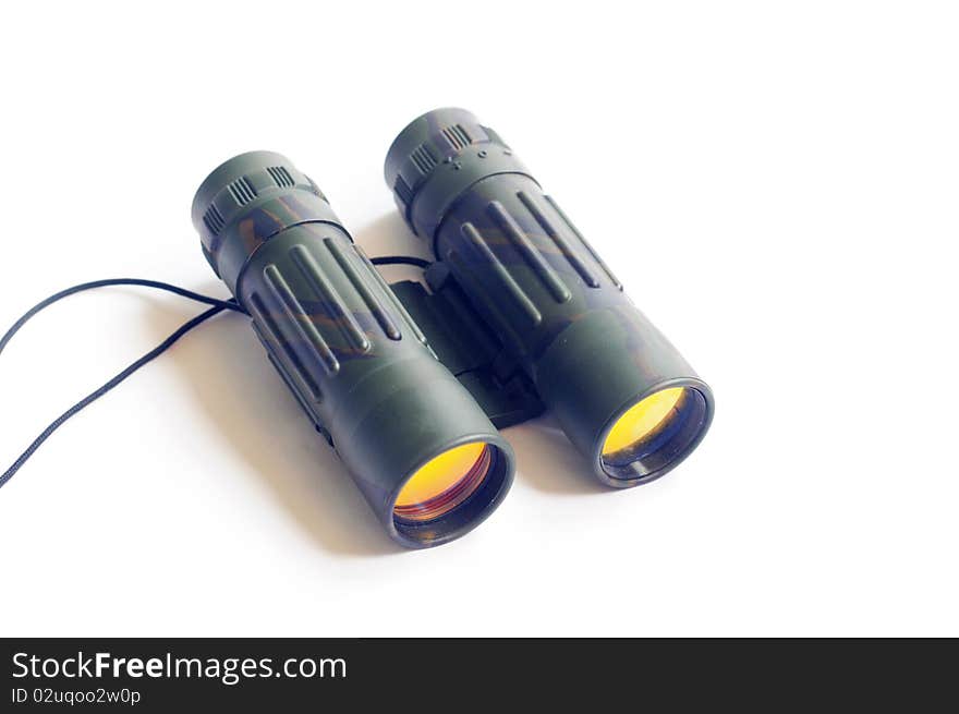 Close-up view of binoculars isolated on a white background